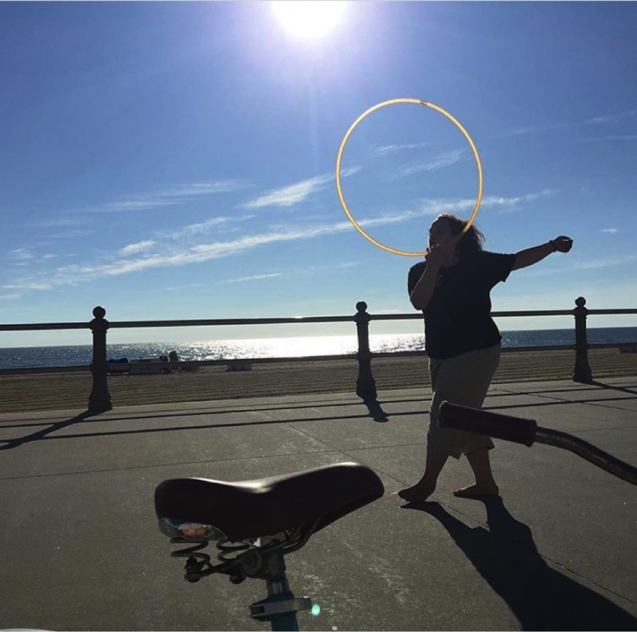 Creator of the club, Hannah Petty hoops at the Virginia Beach Oceanfront. 