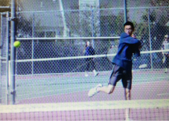 Brian practicing for a tennis match before spring break.