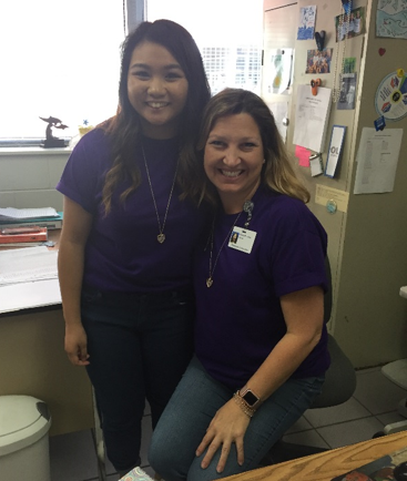 Senior Eliza Navarro and English teacher Alexis Jones Purpled Up to support military.