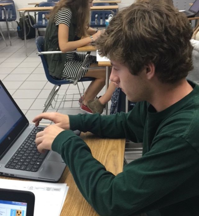 Luksik sits in his English 12 class after receiving a perfect score on his ACT.