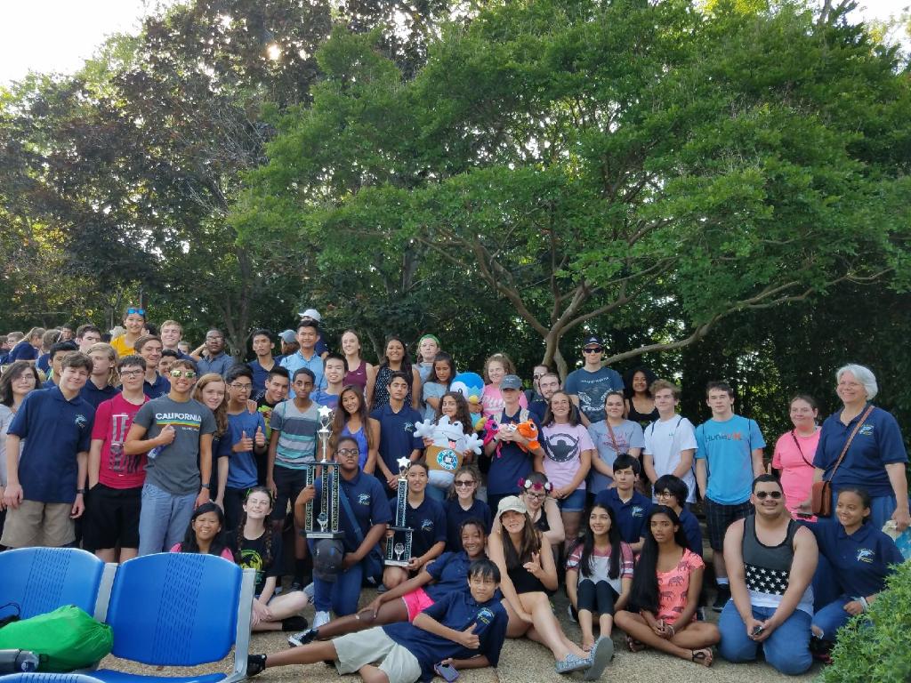 The+orchestra+at+Busch+Gardens+holding+their+first+place+trophies.+Picture+taken+by+Makenna+Miller.+