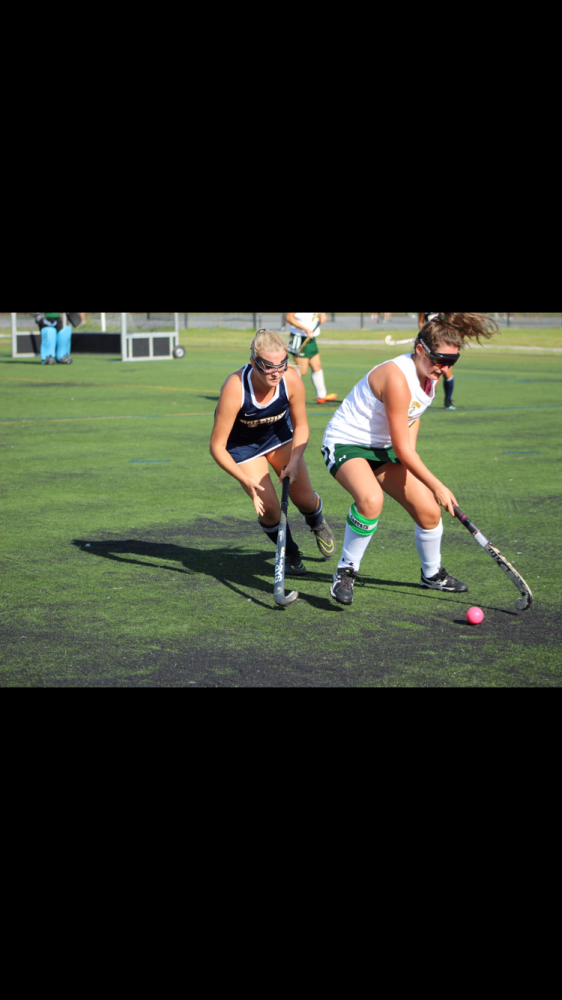 On September 7 at Bishop Sullivan Catholic High School, senior and team captain, Delaney Hinkley (left) channels Christina Sandes (right) towards sideline to gain possession of the ball. Photo by Samantha Simmons.