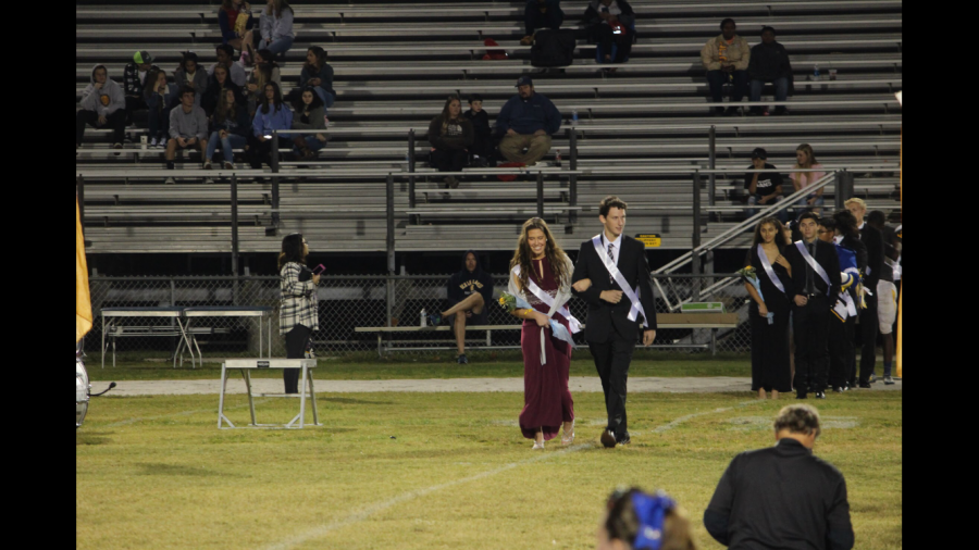 Photo by: Kelly Singer. 
Chloe Bishop and Micah Singer represented the junior class during the Homecoming presentation. 