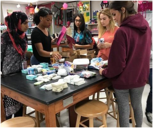 Photo Submitted by Anne Gill
Students of Cy-Fair receive and sort through one of the fifteen boxes sent by Ocean Lakes.
