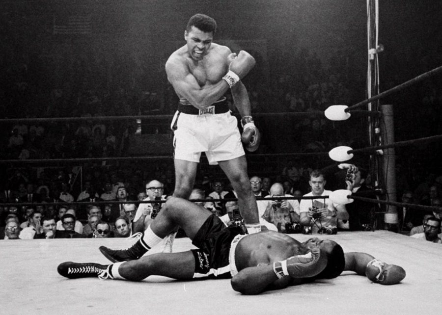 Muhammad Ali standing over Sonny Liston. Ali declared the winner. 