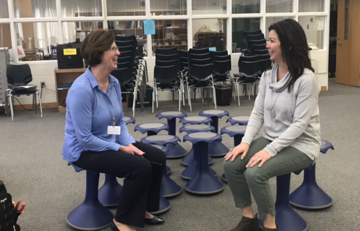 Leblanc and Leary testing out the new seats in the library.