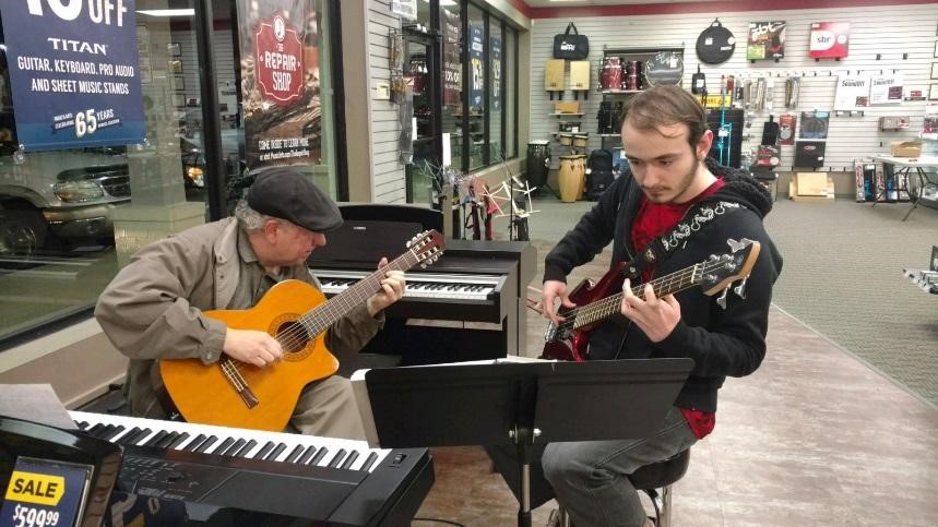 Depicts Tommy Shields playing the bass at Music and Arts store. 