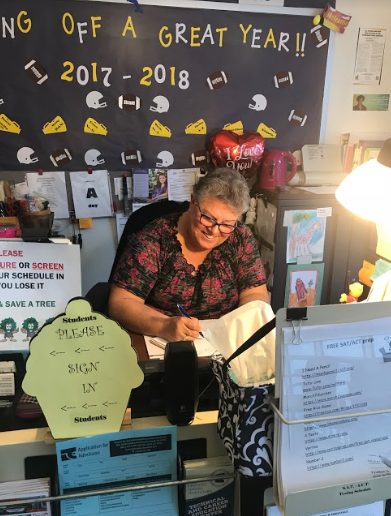 Both security and assistant staff member Cheryl Lint organizes and prepares administrative tasks in the Guidance Office.