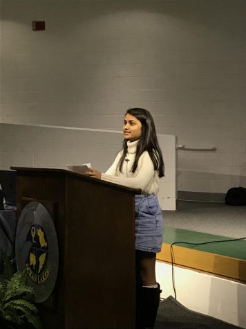 Senior Rutvi Patel presents her capstone project on oncology in the schola on March 23. 