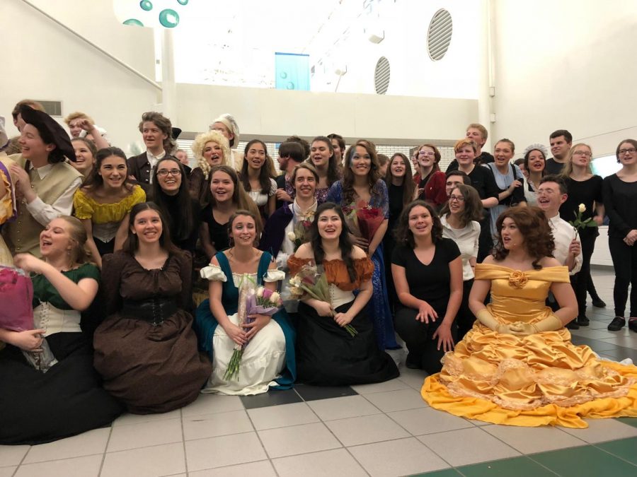 Cast and crew in their costumes celebrating after their performance. Taken by Makenna Miller.