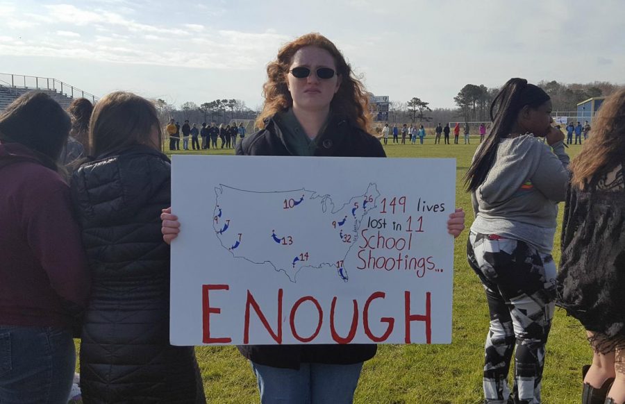 During+the+national+student+walkout%2C+senior+Autumn+Robert+s+created+and+held+a+poster+that+read%2C+%E2%80%9C149+lives+lost+in+11+school+shootings%E2%80%A6+ENOUGH%E2%80%9D.+Taken+Dylan+Young