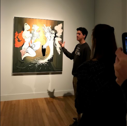 Photo of senior Sebastian Grant talking about a work of art.