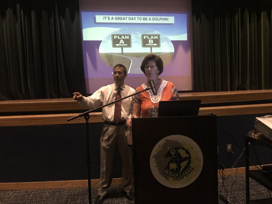 Assistant Principal James Imbriale (left) and Principal Claire Leblanc (right) welcome the senior class. 