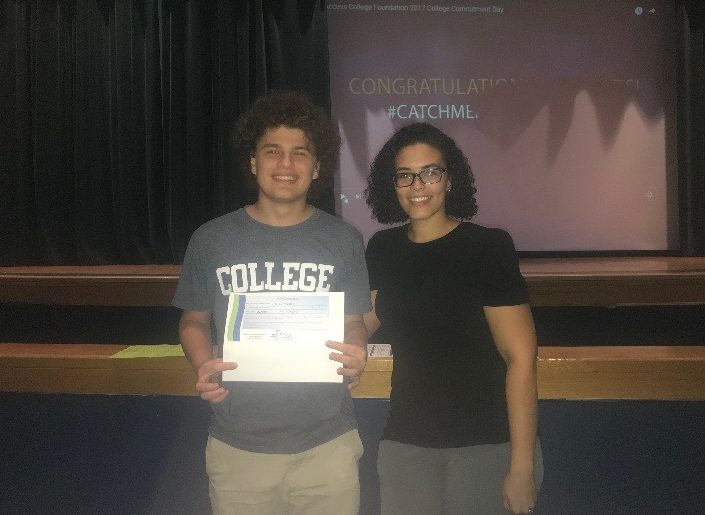 Max Lichtenstein accepts scholarship from Amy Hall in the school auditorium on Monday, Sept. 24. 