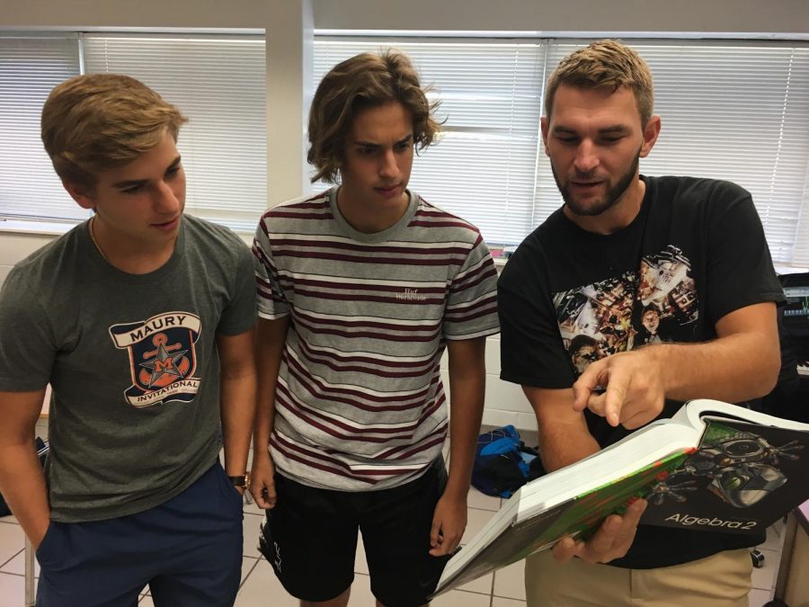 Pierce informing students (left to right) Alex Cigularov and Matt Escobar on Oct. 5 