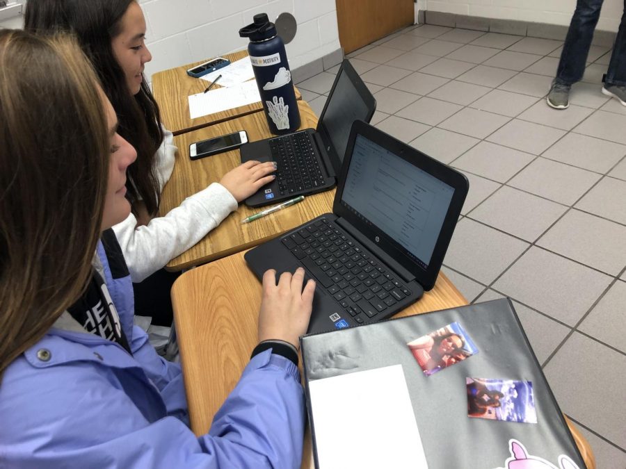 Seniors Sara Burtner and Marie Wickard take political ideology quizzes in Pohl’s 2B AP government class on their Chromebooks. Photo on Nov. 15 in room 158.