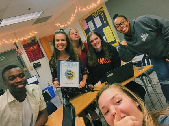 A few Leadership Workshop staff members (left to right) Nelson Soga, Abby Asimos, Caroline Hampton, Logan Zell, and Naia Smith pose with Conaway. 