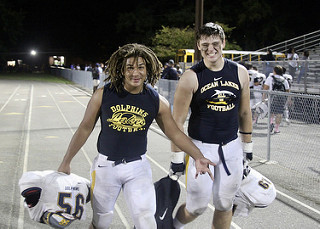 Jordan Green and Tyler Stevens walking back to the buses after the win over Green Run. 