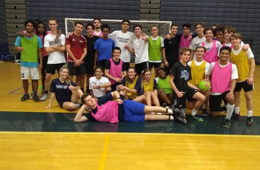 Boys and girls soccer teams practice together in the gym on Jan. 4 to improve skills for season.