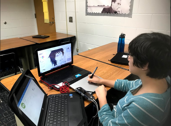 Senior Taylor Dinh draws with her tablet on her personal laptop during downtime in Christina Barnhart’s 4A finance class on Wednesday, Jan. 30. 
