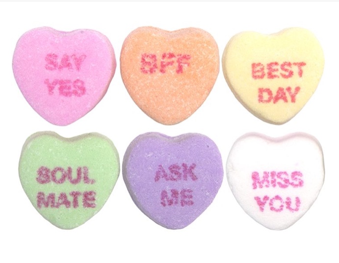 According to Huffington post, these conversation hearts were originally called motto hearts, their precursor was a trendy fortune cookie-like treat sold during the Civil War called a cockle, which had printed phrases rolled up inside its scallop-shaped shell. Printing words directly on the candy was the bright idea of Daniel Chase, the brother of NECCOs founder.  Photo from Google Images, edited by Fara Wiles.