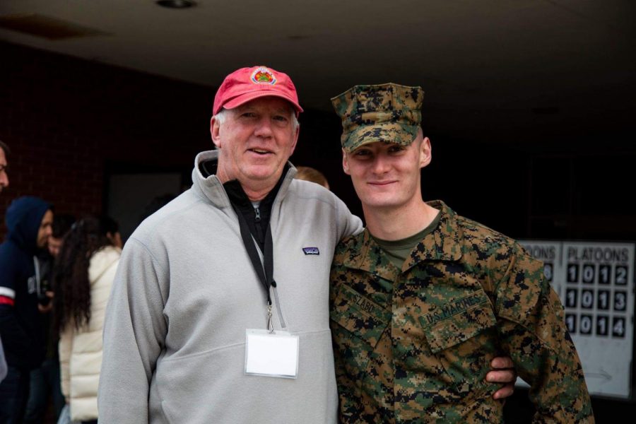 English teacher John Kelly connects with former student Bela Szabo at the Marine Corps boot camp graduation. 