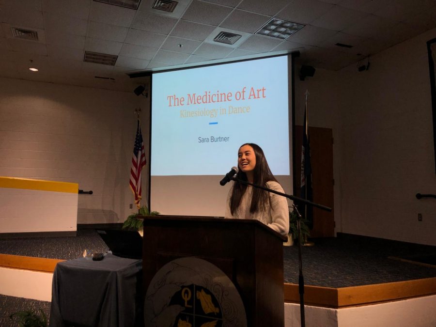 Senior Sara Burtner introduces her senior capstone project in the Schola on March 19, 2019.