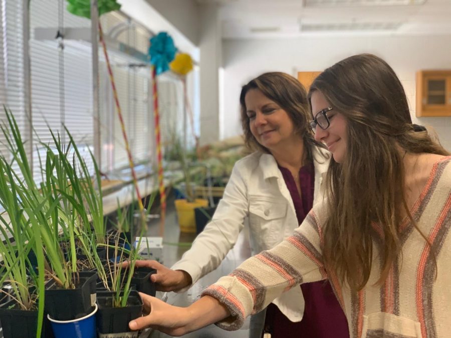 Junior Grace Strzalko and her teacher shadow Fara Wiles admire some plants during Graces AP Environmental class. May 8.