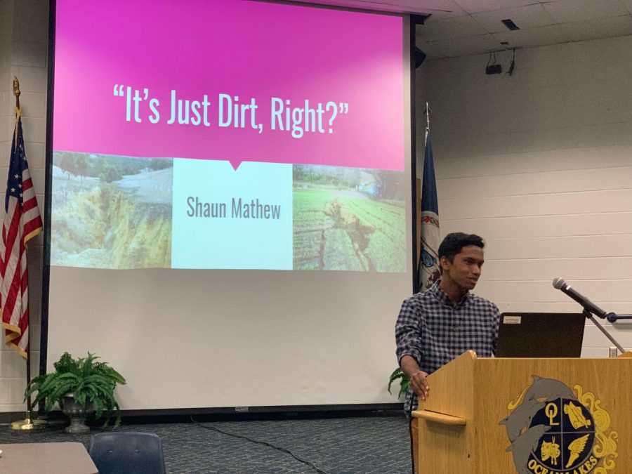 Junior Shaun Mathew begins his presentation on top soil erosion on Tues., May 28 in the schola. 