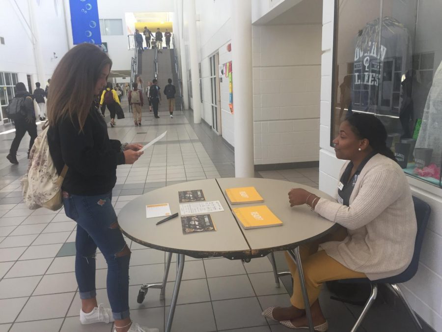 Senior Breanna Acosta talks to MBU admissions counselor Brittany Roberts about the programs available through the college.