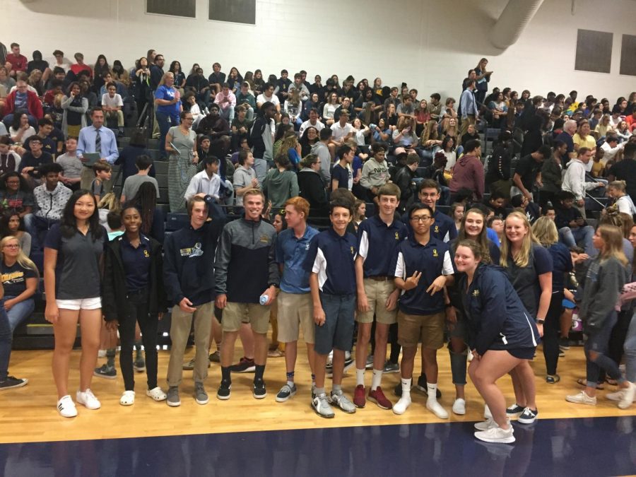 Golf team stands for recognition at fall sports assembly on Sept. 25.