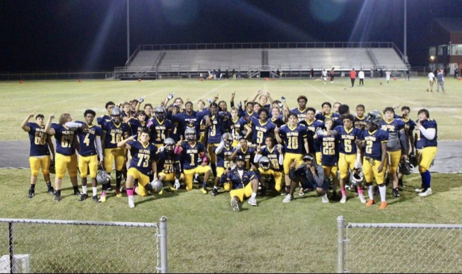 The Dolphins celebrate defeating the Bayside Marlins to finish their undefeated season.