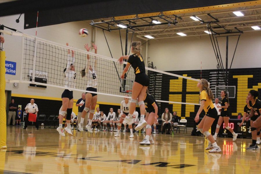Girls volleyball stretches towards a spike. October 22, 2019.