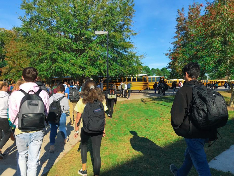 Students make their way to the buses after school at current end time, 2:10 pm.