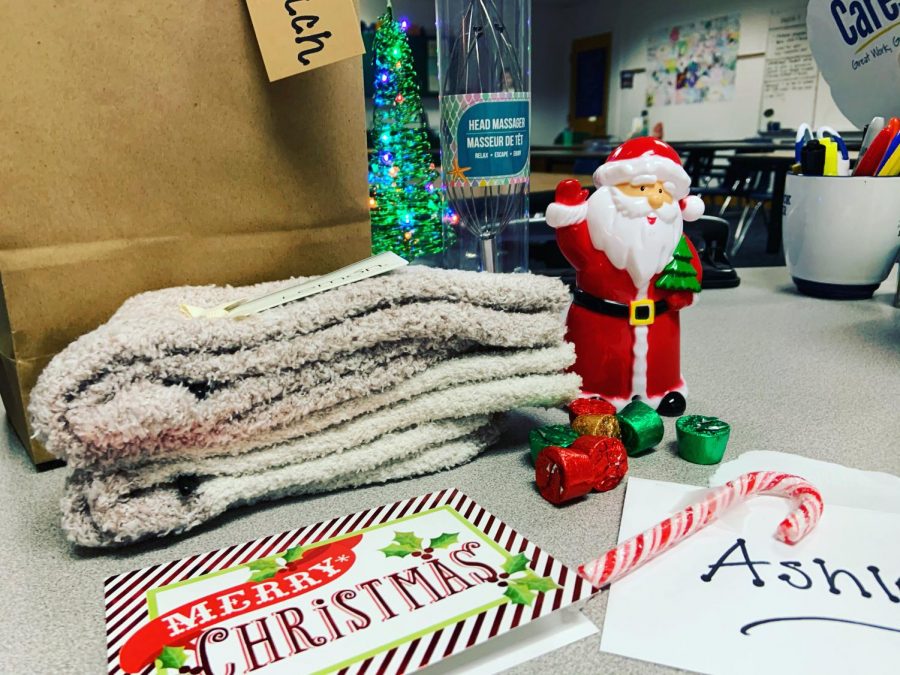 On the first day of the English Department Secret Santa, teacher Ashley Adams received her first of the five sensory gifts teacher Carol Seacrist snuck into room 145. The personal 