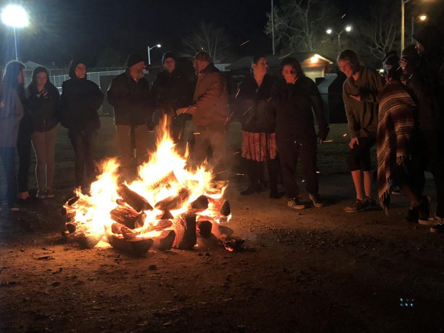 Students and faculty gather around the SCA-sponsored bondfire on Dec. 18.