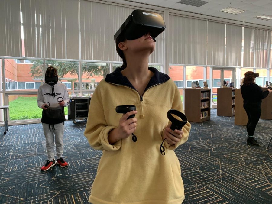 Senior Nascia Phillips explores the augmented reality app in the library on Jan. 23.