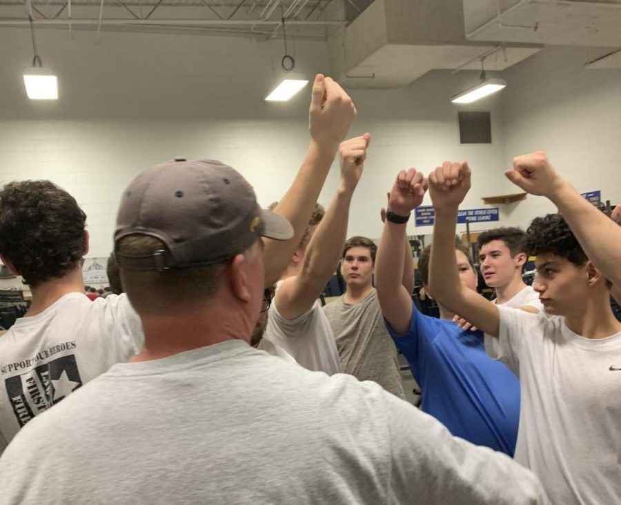 Ocean Lakes Boys Lacrosse Club puts hands in after workout on Jan. 21, 2020.