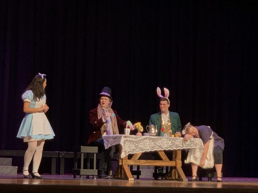 From left to right, Britanie Rivera plays Alice, Morgan Fine plays The Mad Hatter, Thomas Chick plays the Hare, and Brielle Bradt plays the dormouse. 