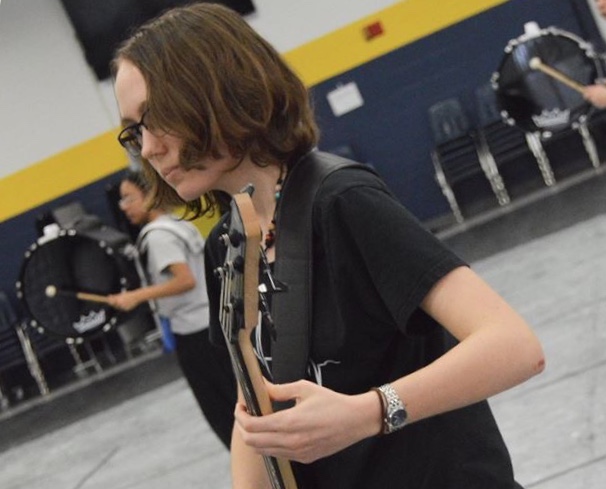 Rachel Owen performed on bass guitar in the cafeteria for the OLIPE (Ocean Lakes Indoor Percussion Ensemble) production, “Awaken.” 