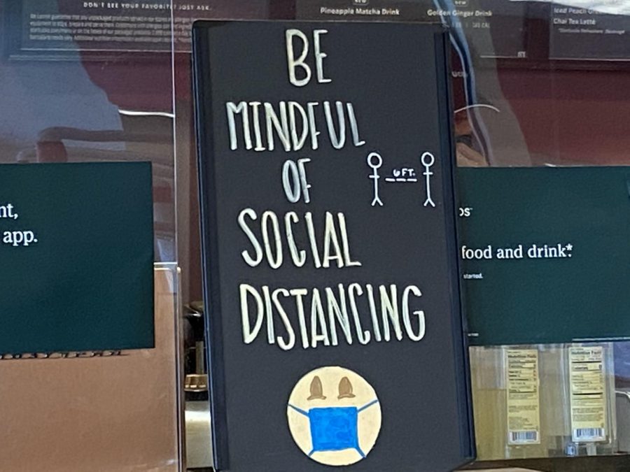 Reminder to follow social distancing rules in Starbucks.