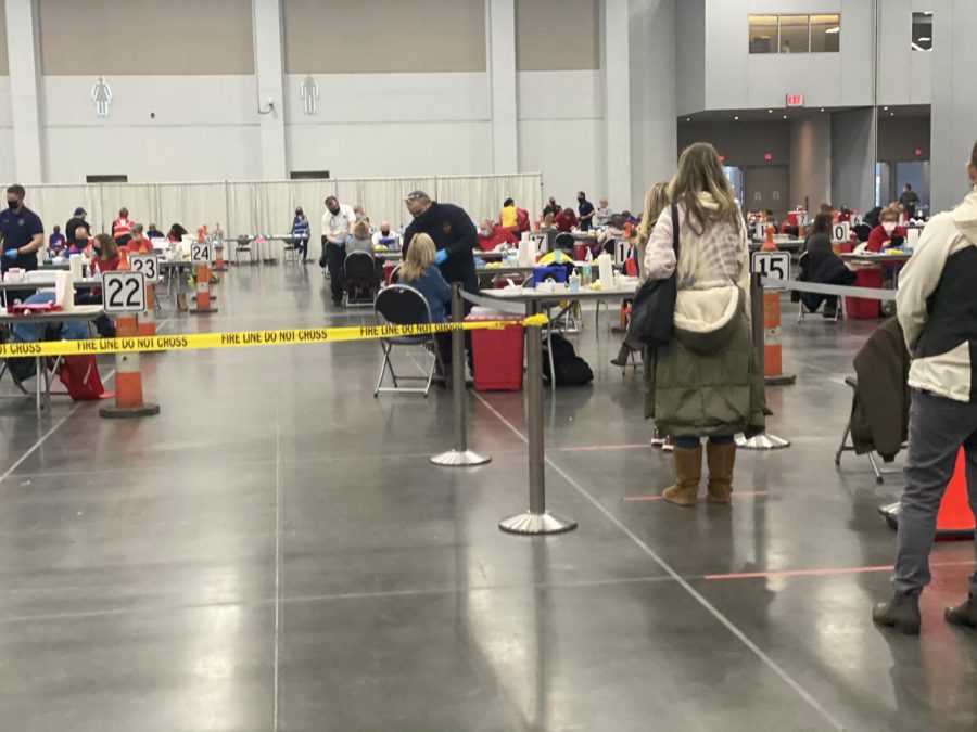 Math teacher Susan John and other Virginian residents stand in line to receive their second vaccination at the Virginia Beach Convention Center on Feb. 18.