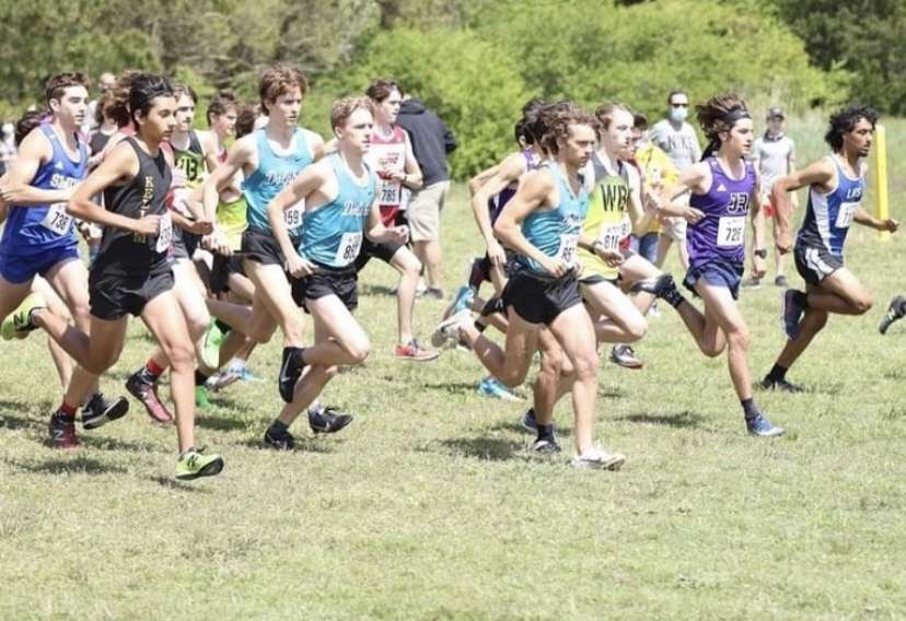 Photo of Harrison Ladd (RIght), Aidan Bolger (Middle), and Owen Lipps (Left) Racing in cross country 6A regional championship at Bells Mills April 17th, 2021. 
