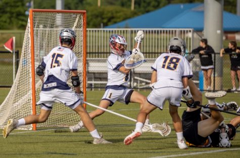 Max Keller, Joshua Esposa, and Ryan Devlin defend the goal against Kellam Knights on May 12 at the Princess Anne Athletic Complex.