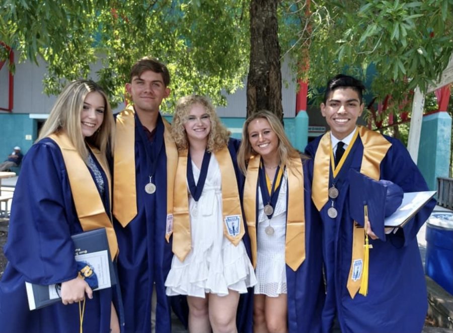 From right, two of ten medallion recipients, Reese Thornton and Alan Ledezma, wearing their medallions, stand with fellow graduates after their June 18 ceremony, held at the Virginia Beach Amphitheater. 