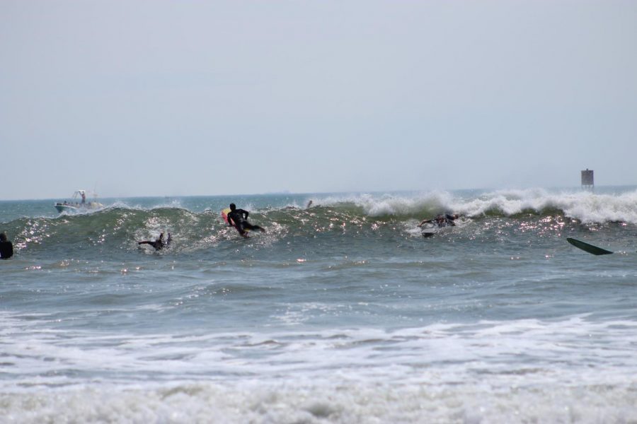 Local groms surf at Croatan Beach on May 24. 