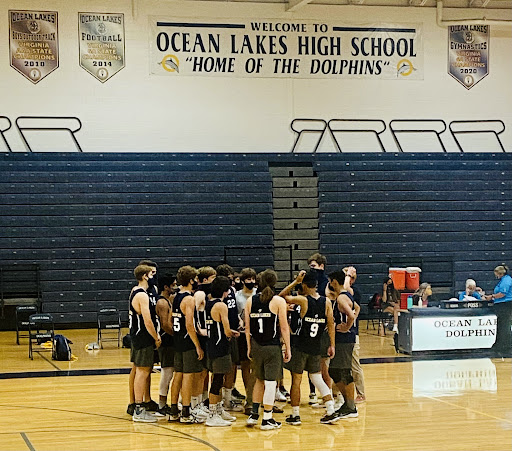 The Dolphins finish their second game with a 3-0 victory over Great Bridge on Wednesday, Sep. 8, at the Ocean Lakes High School Gymnasium. (Ryeligh Probst, Grade 12)