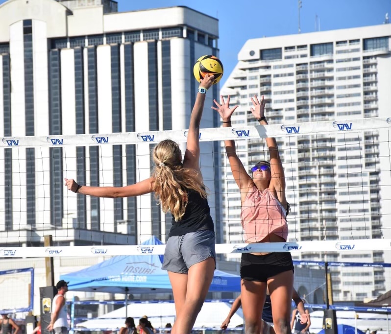 Riley knuckles the ball over the opponents hand securing a point at a tournament in Clearwater, Florida, on July 12, 2021. 