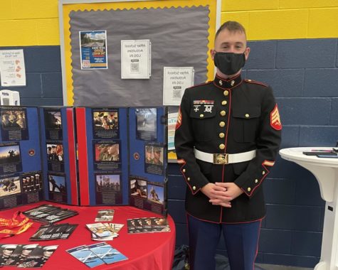 Marine Corps recruiter, Michael Hemberlain, displays his presentation to students at lunch on Oct. 6. 