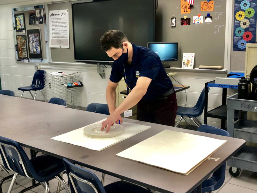 New Art teacher, Chris Heidt, prepares a lesson for his Art I Foundations class in October. 